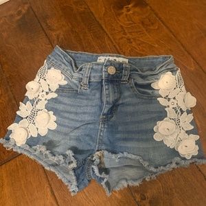 Womens denim shorts with white flower detail